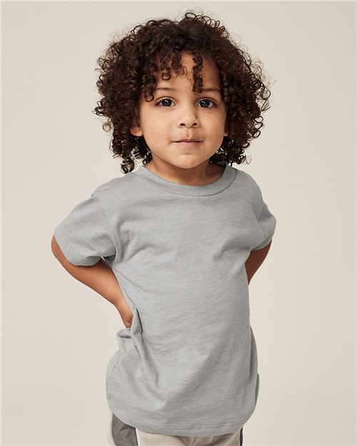 Load image into Gallery viewer, A curly-haired child wears a gray BELLA + CANVAS Toddler Triblend Tee against a neutral background, smiling slightly with hands behind their back, reflecting the comfort and sustainability of Blue Sign certified apparel.
