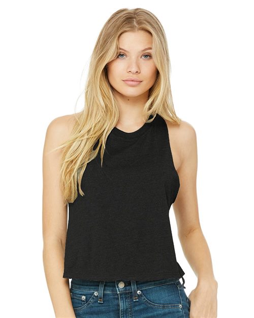 Load image into Gallery viewer, The long-haired person in blonde is wearing a black BELLA + CANVAS Women's Racerback Crop Tank made from Airlume cotton, paired with blue jeans, against a plain white background, highlighting stylish and sustainable fashion.