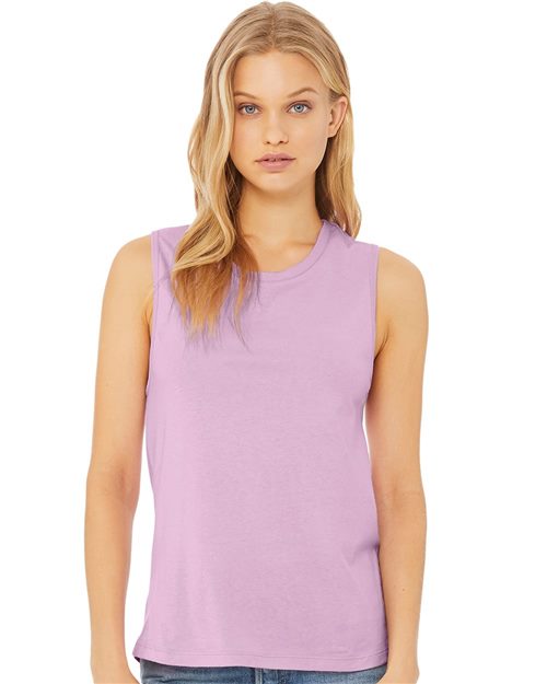 Load image into Gallery viewer, A woman with long blonde hair wears a BELLA + CANVAS Women's Jersey Muscle Tank in light purple and blue jeans. Standing against a plain white background, she looks directly at the camera with a neutral expression.