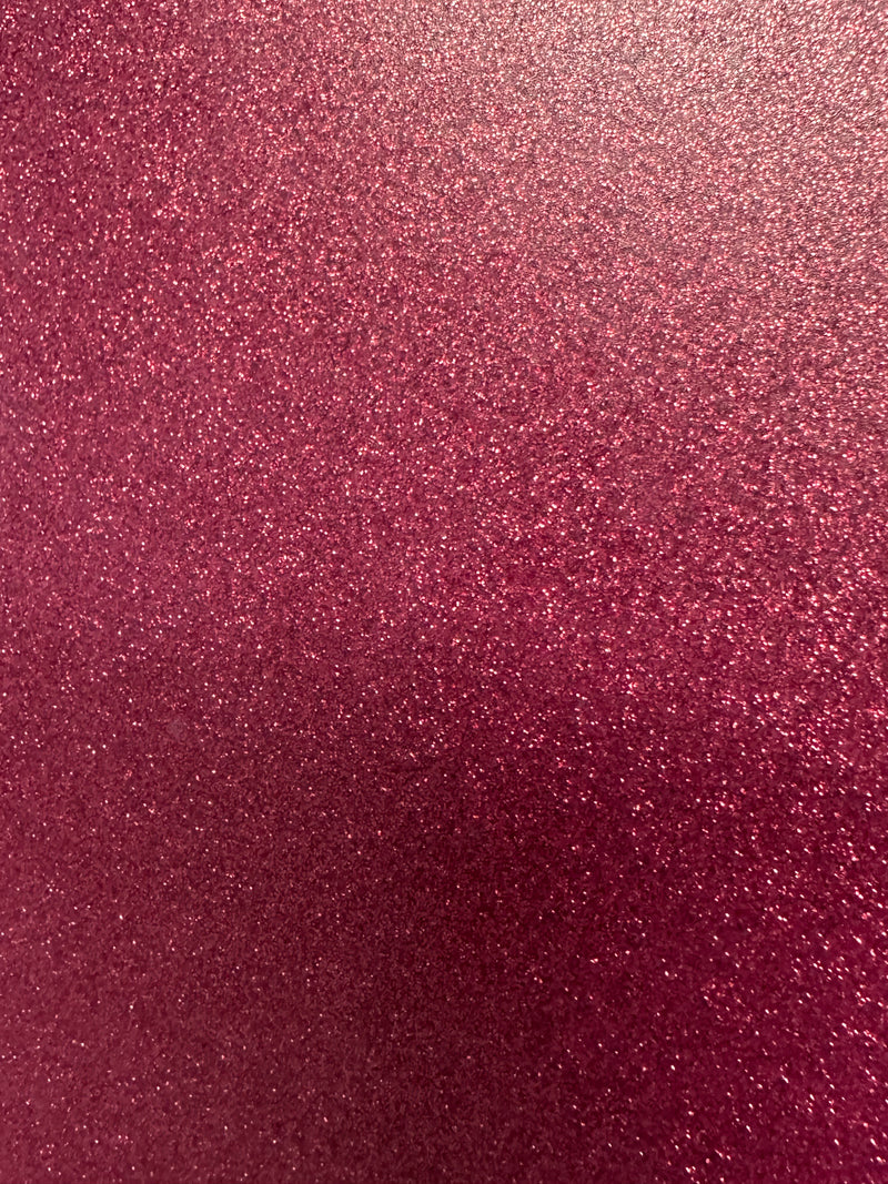 Load image into Gallery viewer, The image showcases Quick Transfers' EconoGlitter Vinyl, 19.8" x 12", featuring a durable, sparkling pink glitter texture that fills the space with a shimmering visual effect. The varied particle sizes reflect light, adding depth to its vibrant pink surface.