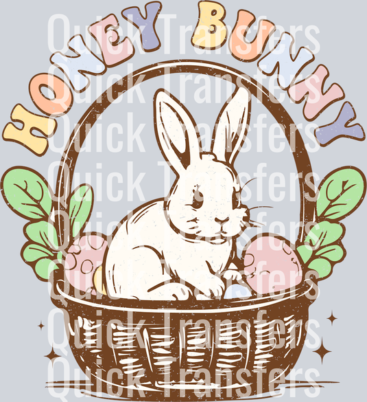 The Adorable Honey Bunny Easter Basket Eggs DTF Transfer by Quick Transfers features a cute white bunny in a basket with Easter eggs and leaves, plus