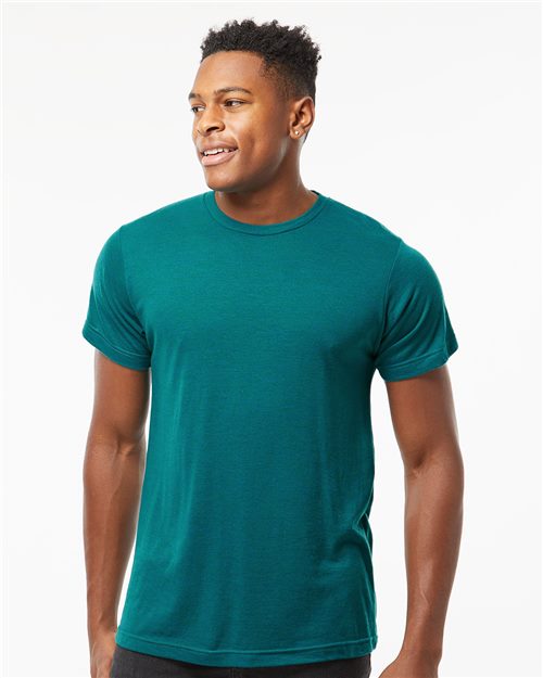 Load image into Gallery viewer, A smiling man wears a teal Tultex - Tri-Blend T-Shirt, made of polyester and ring-spun cotton, representing Sustainable Style against a white backdrop. He looks right with relaxed arms, exuding comfort that’s OEKO-TEX Standard 100 certified.
