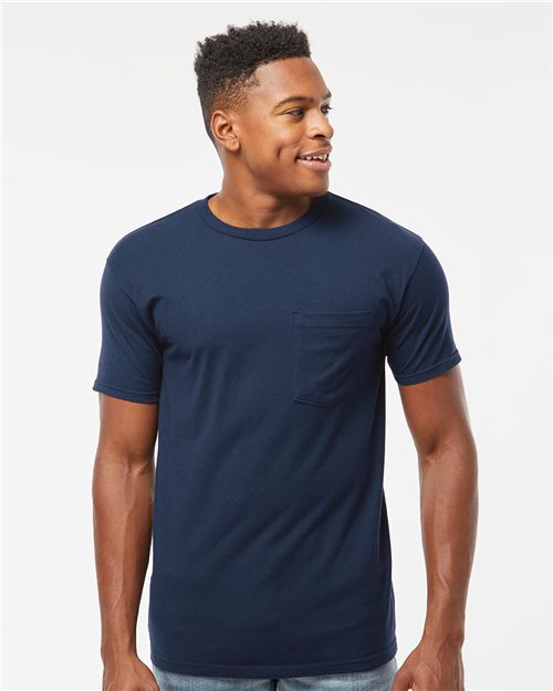 Load image into Gallery viewer, A man wearing a Tultex Heavyweight Jersey Pocket T-Shirt in dark blue, made from USA cotton with short sleeves, stands and smiles against a plain white background.
