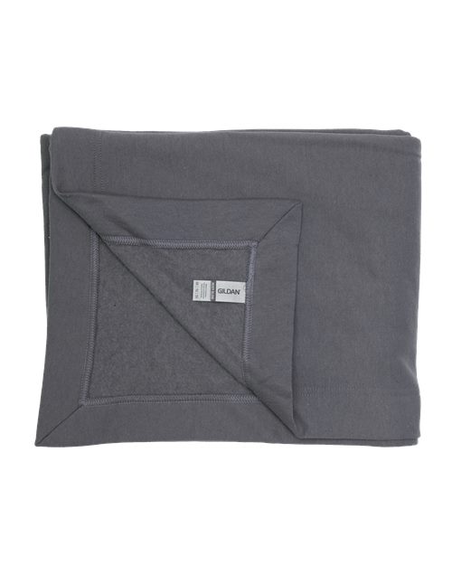 Load image into Gallery viewer, A neatly folded dark gray Gildan Heavy Blend Fleece Stadium Blanket features a brand tag on one corner. Made from a heavy blend, it offers a soft and smooth feel, ensuring cozy comfort and peace of mind with OEKO-TEX certification.
