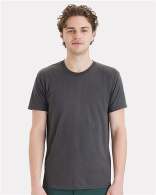 A man with short curly hair wearing a Hanes - Perfect-T DTG T-Shirt in dark gray cotton stands against a light gray background.