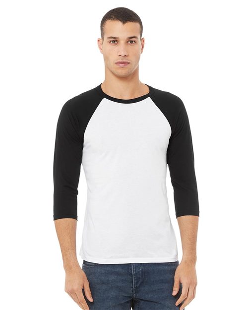 Load image into Gallery viewer, A man in a BELLA + CANVAS Three-Quarter Sleeve Baseball Tee, made from Airlume combed cotton, stands against a plain backdrop. With short hair and blue jeans, he looks directly at the camera. The shirt offers unisex sizing for a perfect fit.
