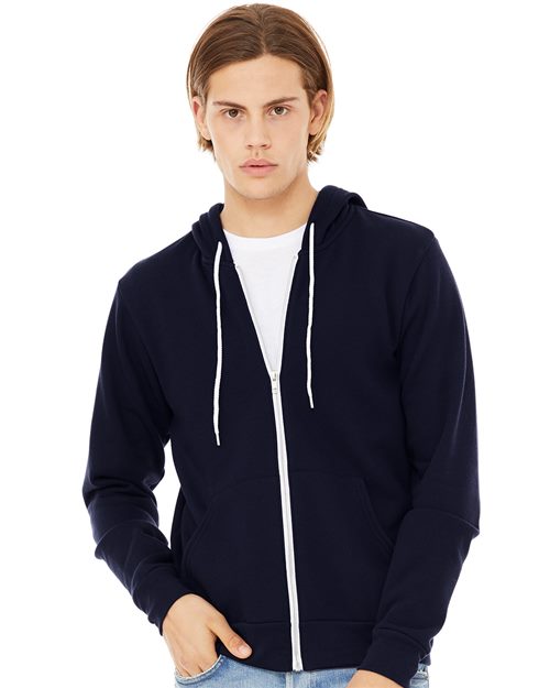 Against a plain white background, a person wears a BELLA + CANVAS Sponge Fleece Full-Zip Hoodie in navy over a white t-shirt. Their medium-length light brown hair complements the Airlume combed and ring-spun cotton outfit, ensuring comfort and quality.