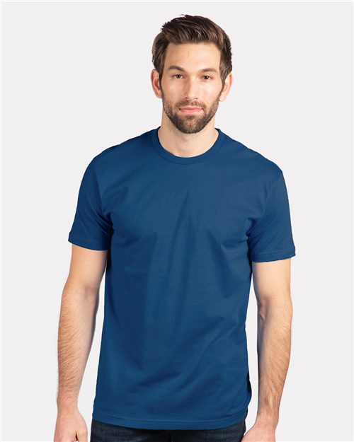 Load image into Gallery viewer, A man with short brown hair and a beard stands against a white background, wearing the Next Level - Cotton T-Shirt. Made from combed ring-spun cotton, he looks directly at the camera with a neutral expression, showcasing socially conscious manufacturing standards by Next Level.
