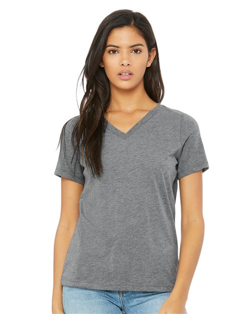 Load image into Gallery viewer, A person with long dark hair wears a grey BELLA + CANVAS Women&#39;s Relaxed Triblend Short Sleeve V-Neck Tee and blue jeans, standing against a plain white background, facing forward.
