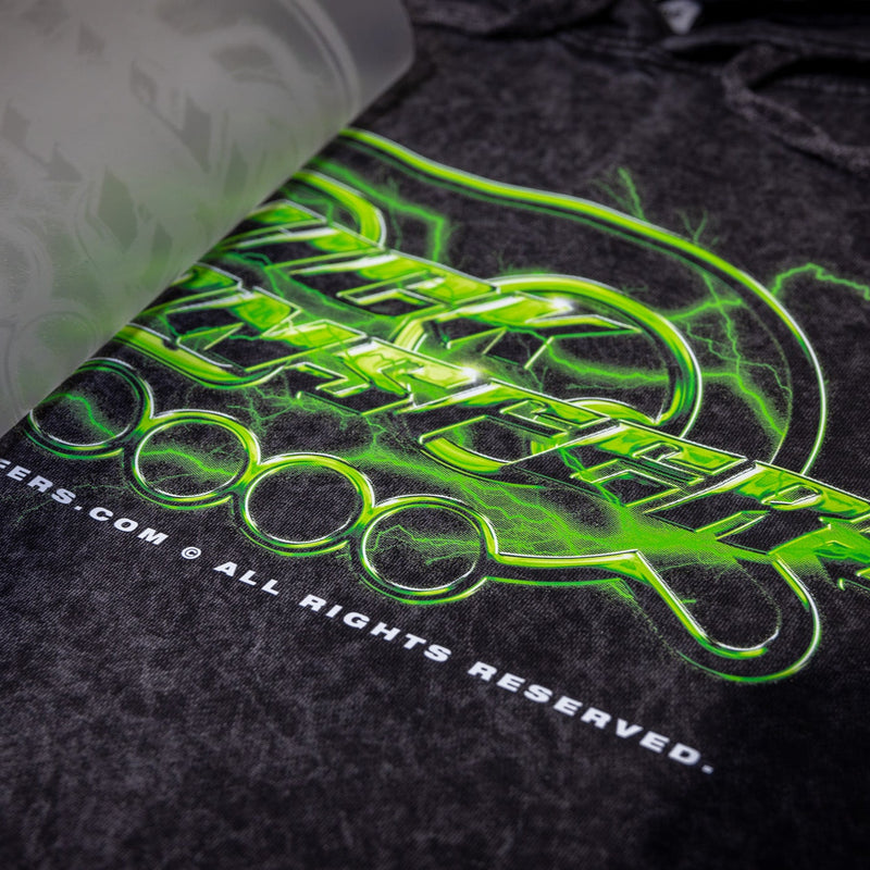 Load image into Gallery viewer, Close-up of a Quick Transfers dark shirt with a vibrant green logo using FASTFILM™ DTF TRANSFERS, partially hidden by translucent film. &quot;ALL RIGHTS RESERVED&quot; is printed at the bottom against a textured fabric background.
