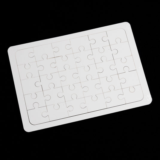 A Quick Transfers Blank Sublimation Puzzle (7x10") of interlocking pieces sits on a black background, highlighting their light color and inviting your personal touch to make it unique.