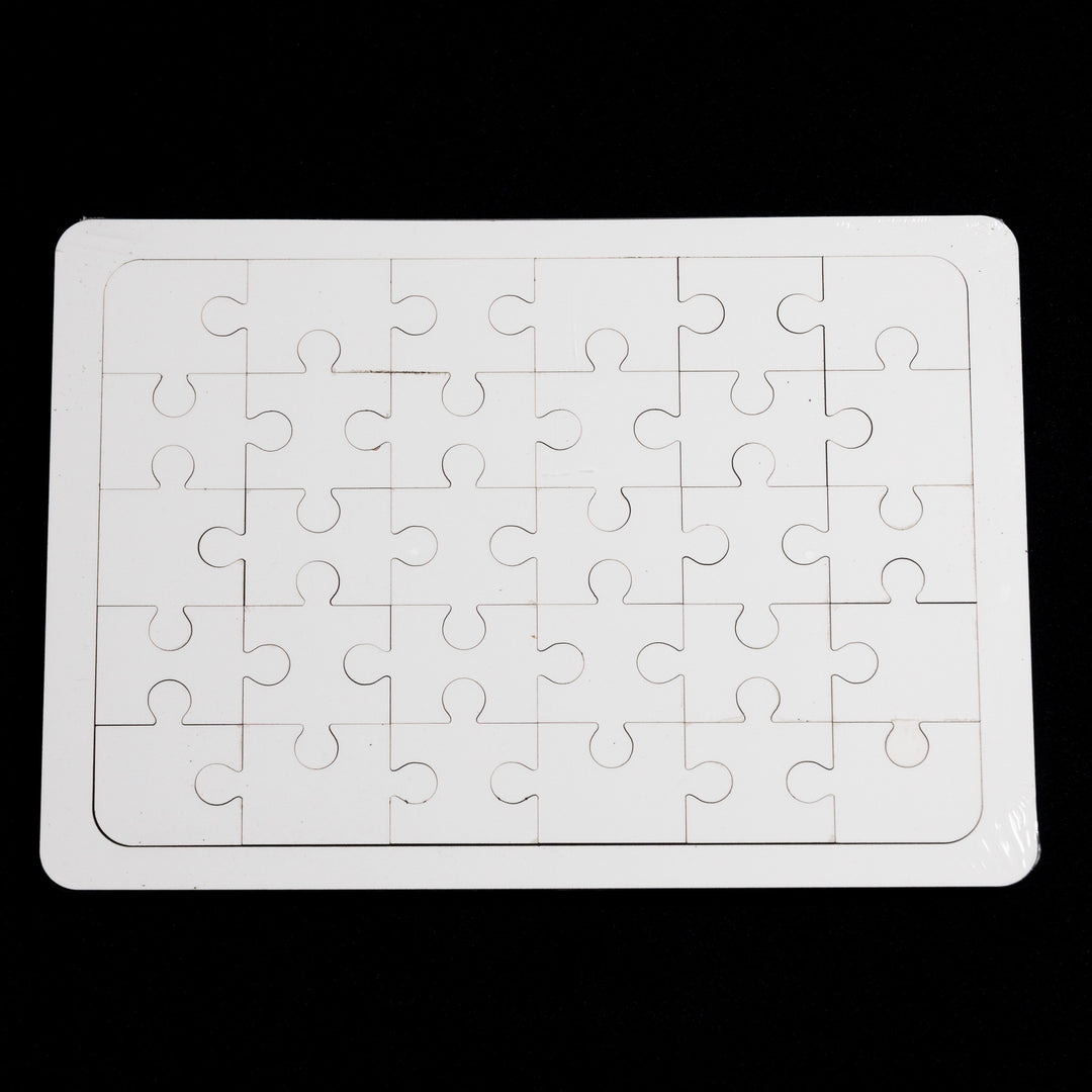 The Quick Transfers Blank Sublimation Puzzle (5x7") has 24 interlocking pieces in a 6x4 grid on a black background, featuring a white border. Ideal for personalizing with sublimation transfers to add that unique touch.