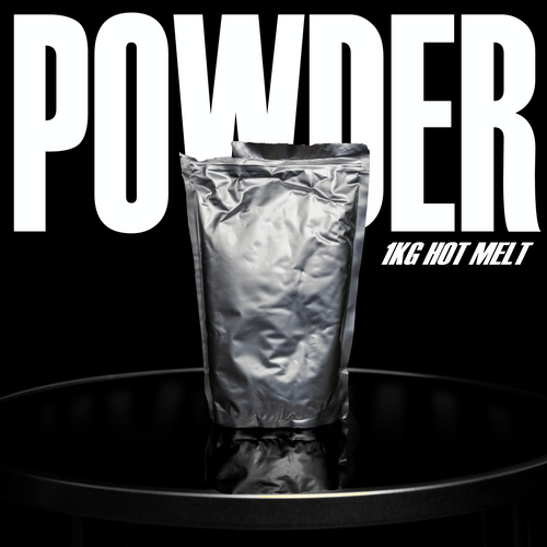 A silver foil bag stands upright on a glossy black surface. 