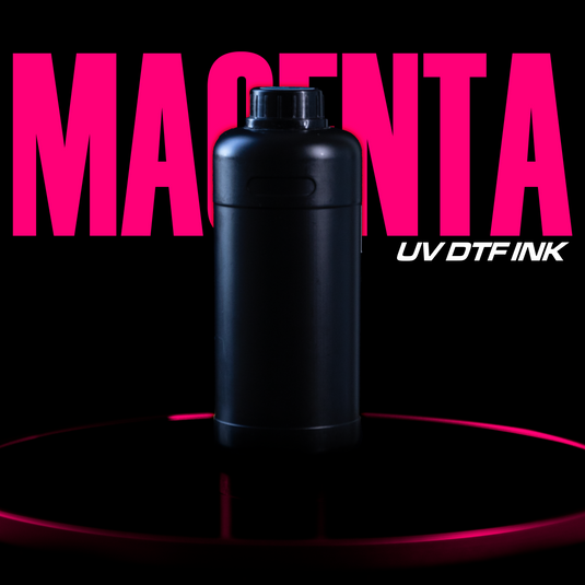 A black bottle stands on a circular platform with a vibrant pink glow, highlighting DTF Locker’s impressive Magenta UV DTF Ink. The word "MAGENTA" appears in bold pink in the background, emphasizing the product's excellence and stunning Vibrant Color Fidelity.
