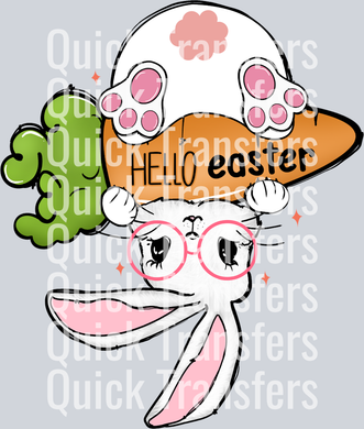 The Quick Transfers Hello Easter Cute Bunny Glasses Carrot DTF Ready Transfer features a white bunny with pink glasses, holding a 
