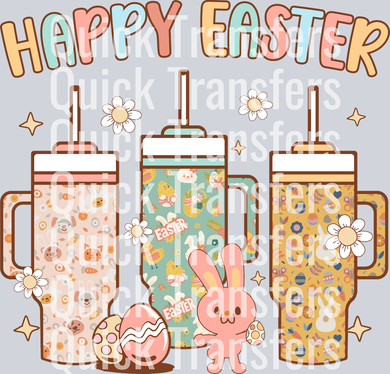 The Vibrant Happy Easter Bunny Tumbler Trio DTF Transfer by Quick Transfers features three bunny tumblers with festive designs, flowers, a pink bunny with an egg, and 