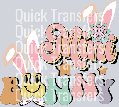 The Whimsical Pastel Mini Bunny Spring Premium DTF Transfer by Quick Transfers features playful block letters with bunny ears, a smiling flower, and stars—perfect for spring crafts. “Quick Transfers” watermark is overlaid for branding.