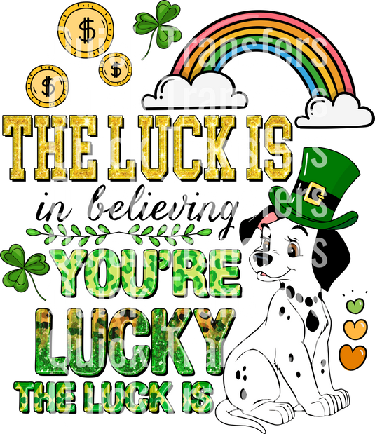 A Dalmatian with a leprechaun hat is beside glittery green and gold text, "THE LUCK IS YOU'RE LUCKY," with a coin, shamrock, rainbow, and cloud backdrop. This design is the "The Luck Is In Believing" DTF Transfer by Quick Transfers.