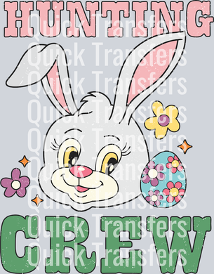 The Easter Bunny Hunting Crew Adorable Egg DTF Ready Transfer by Quick Transfers features a cute bunny face with pink ears, floral accents, and an Easter egg. 