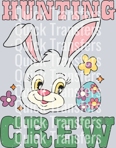 The Easter Bunny Hunting Crew Adorable Egg DTF Ready Transfer by Quick Transfers features a cute bunny face with pink ears, floral accents, and an Easter egg. 