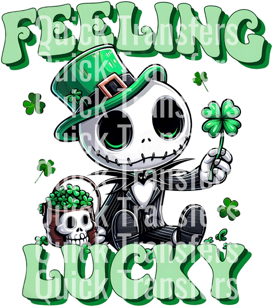 A skeleton in a green leprechaun hat and holding a shamrock sits by a skull-decorated pot with clovers. "Feeling Lucky" is shown in green and white, with "Quick Transfers" printed across. Product: Feeling Lucky Chibi Horror for St Patrick's Day - Ready To Press DTF Transfer by Quick Transfers.