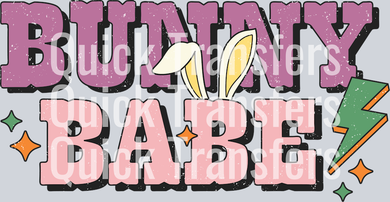 The Bunny Babe Retro Easter Vibrant Lightning DTF Transfer by Quick Transfers features pink and black text with bunny ears—perfect for Easter designs. Ideal for custom apparel using DTF transfers and a heat press.