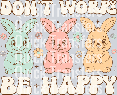 The Premium Dont Worry Be Happy Pastel Bunny Trio Transfer by Quick Transfers features blue, pink, and yellow cartoon bunnies with flowers and peace signs plus bold 