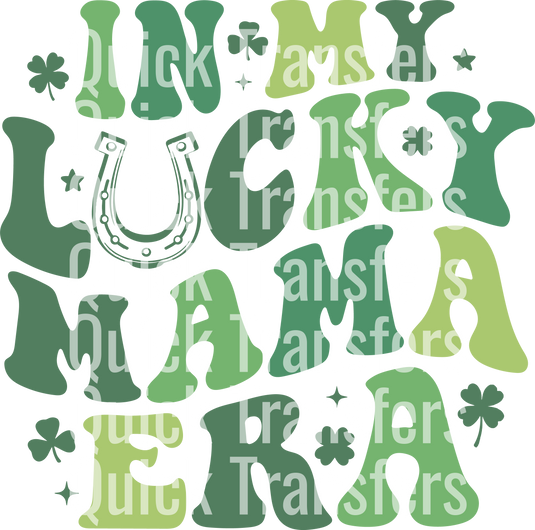 The phrase "In My Lucky Mama Era St Patrick's Day Design," part of the Quick Transfers collection, appears in white text stacked vertically over a green-hued background featuring "Lucky Luna USA" and icons of clovers and horseshoes.