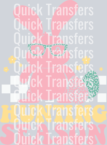 The Charming Retro Bunny With Glasses Hopping Season Transfer by Quick Transfers features a pink bunny in green glasses, a decorated egg, and yellow flowers with “HOPPING SEASON” below in retro Easter style, overlaid with Quick Transfers watermarks.