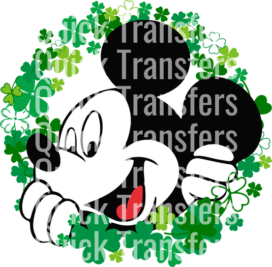 A whimsical mouse with large ears peeks through a wreath of green four-leaf clovers, featuring the "Whimsical Mouse Magic Design" by Quick Transfers.